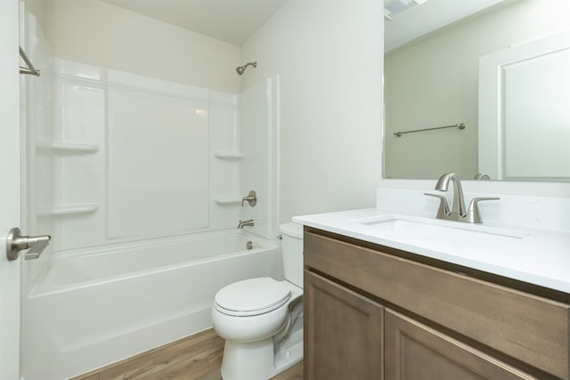 full bathroom with toilet, shower / bathing tub combination, vanity, and hardwood / wood-style floors