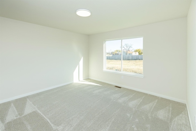 6573 NE 11th Ct, Des Moines, IA 50313 - empty room with carpet floors and baseboards