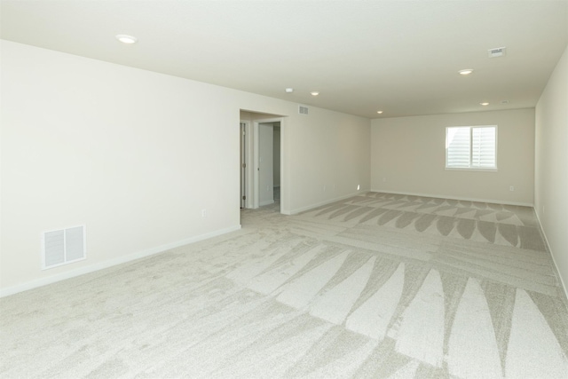 6573 NE 11th Ct, Des Moines, IA 50313 - unfurnished room featuring light colored carpet, recessed lighting, and baseboards