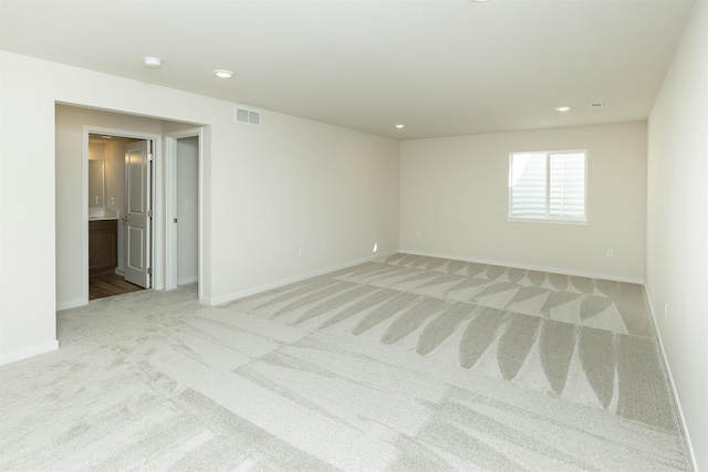 6573 NE 11th Ct, Des Moines, IA 50313 - carpeted spare room featuring baseboards and recessed lighting