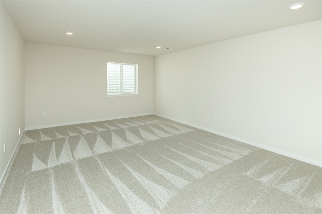 empty room with light colored carpet