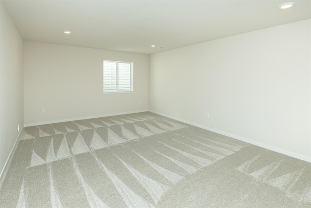 6573 NE 11th Ct, Des Moines, IA 50313 - unfurnished room featuring light colored carpet, recessed lighting, and baseboards