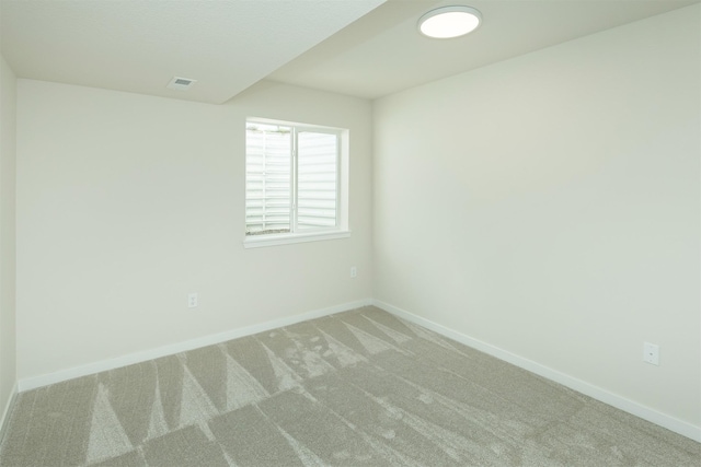 6573 NE 11th Ct, Des Moines, IA 50313 - unfurnished room featuring light colored carpet and baseboards