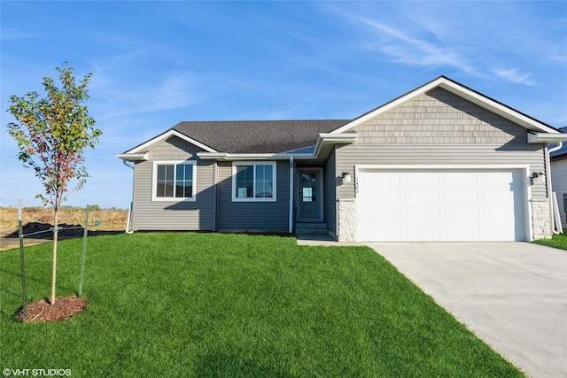 ranch-style home featuring a front yard and a garage