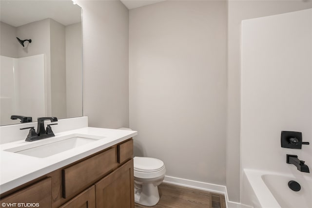 full bathroom with vanity, shower / tub combination, wood-type flooring, and toilet