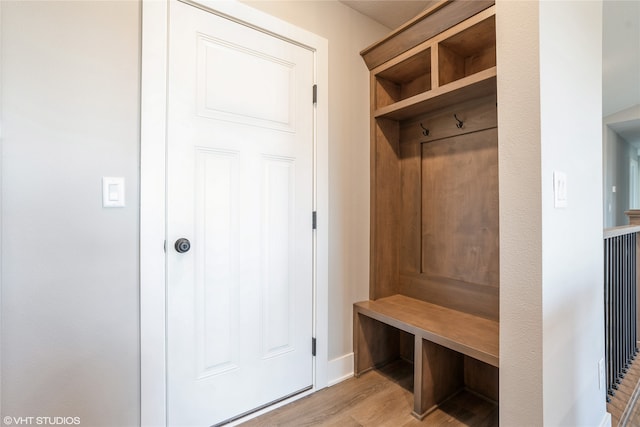 mudroom with light hardwood / wood-style floors