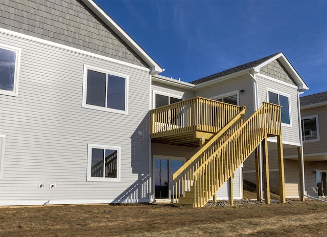 rear view of house featuring a deck