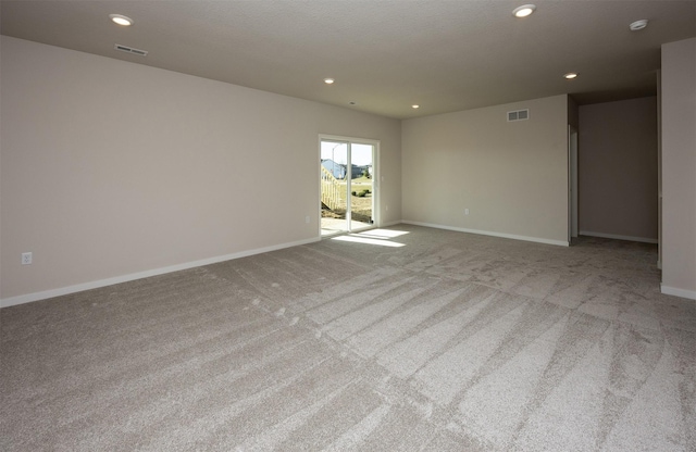 empty room with light colored carpet