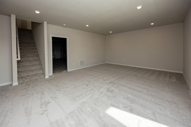 unfurnished living room with light carpet