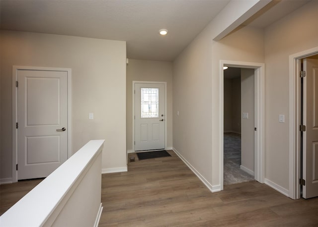 doorway to outside with light hardwood / wood-style flooring