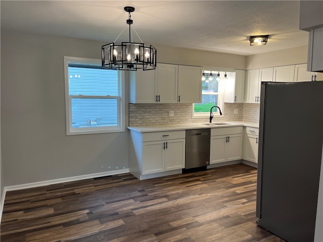 kitchen featuring dishwasher, dark hardwood / wood-style flooring, black refrigerator, and white cabinetry