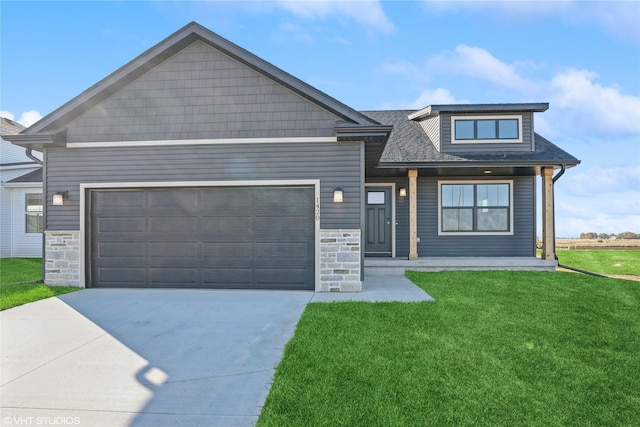 view of front of house with a garage and a front lawn