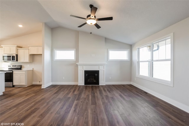 unfurnished living room with dark hardwood / wood-style flooring, vaulted ceiling, and ceiling fan