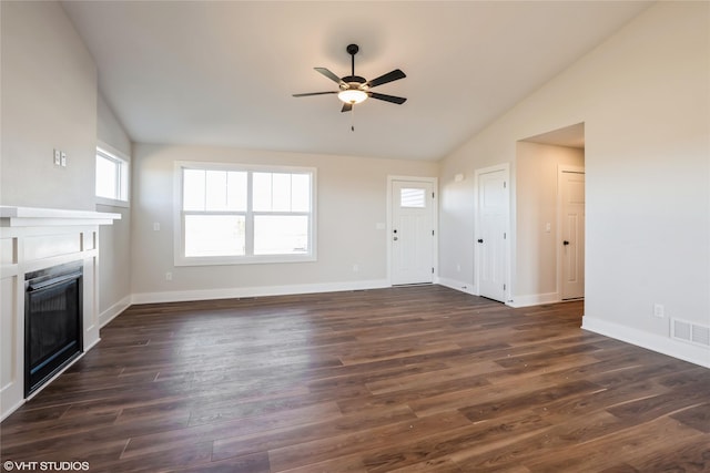 unfurnished living room with vaulted ceiling, ceiling fan, and dark hardwood / wood-style floors