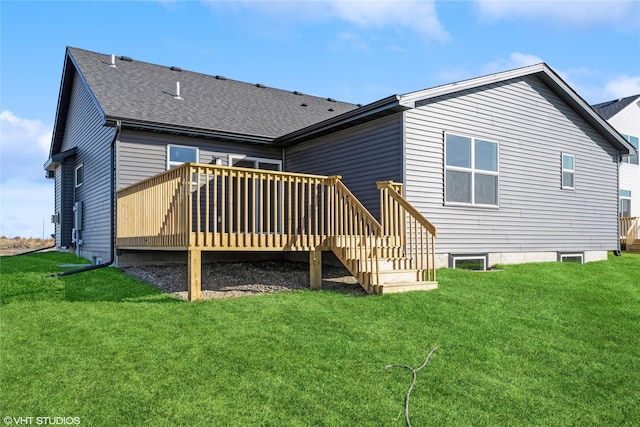 back of house with a lawn and a deck