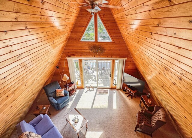 1126 Lakeshore Dr, Brooklyn, IA 52211 - living room featuring wooden walls, carpet, and lofted ceiling