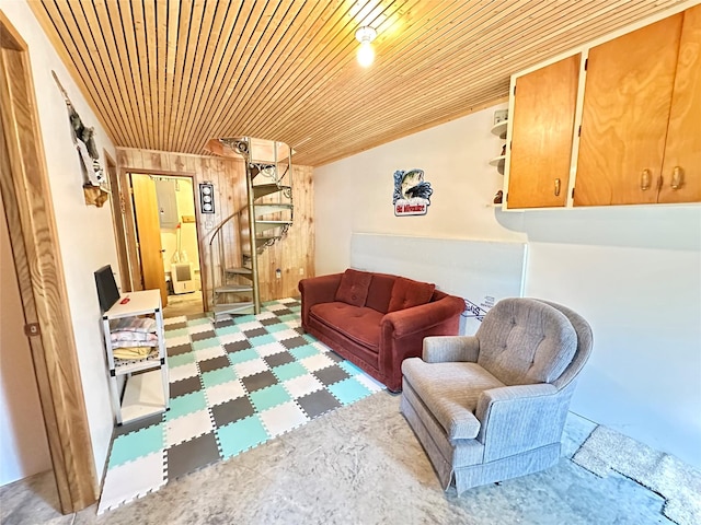 1126 Lakeshore Dr, Brooklyn, IA 52211 - living room featuring wooden ceiling, stairway, wood walls, and tile patterned floors