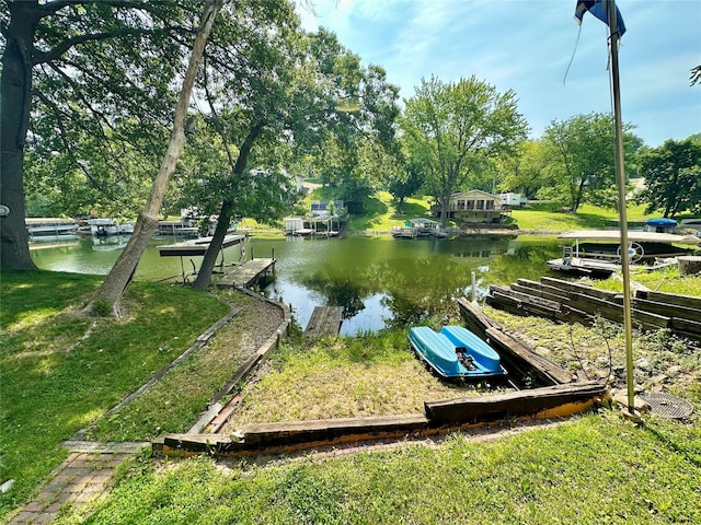 1126 Lakeshore Dr, Brooklyn, IA 52211 - dock area featuring a water view and view of wooded area