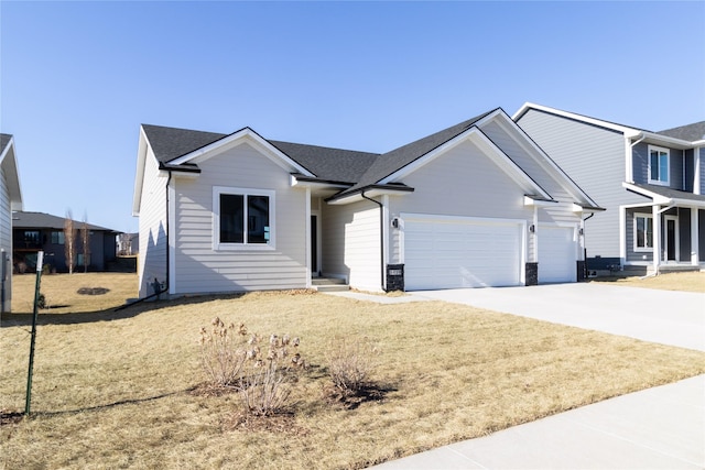 view of front of house with a garage and a front yard