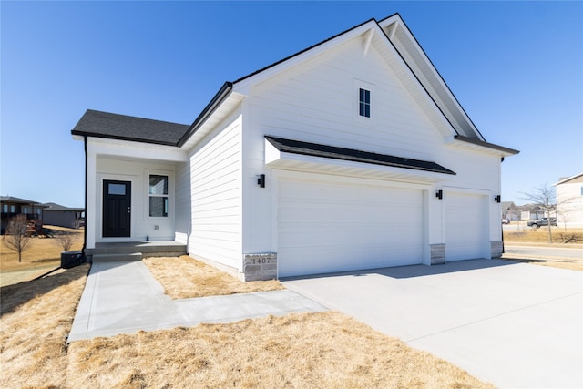 view of front of property featuring driveway and an attached garage