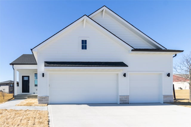 modern farmhouse with a garage and concrete driveway