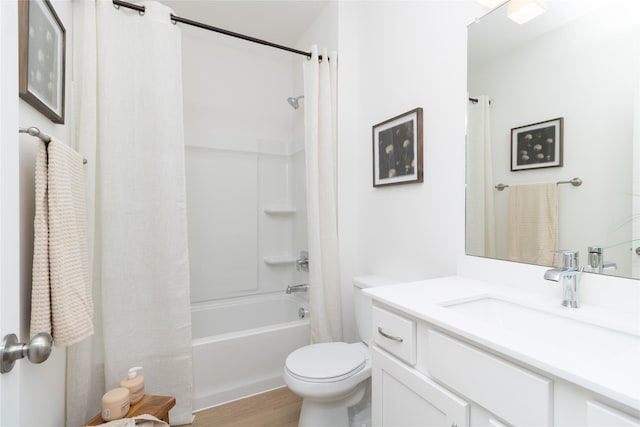 full bath featuring toilet, wood finished floors, shower / bath combination with curtain, and vanity