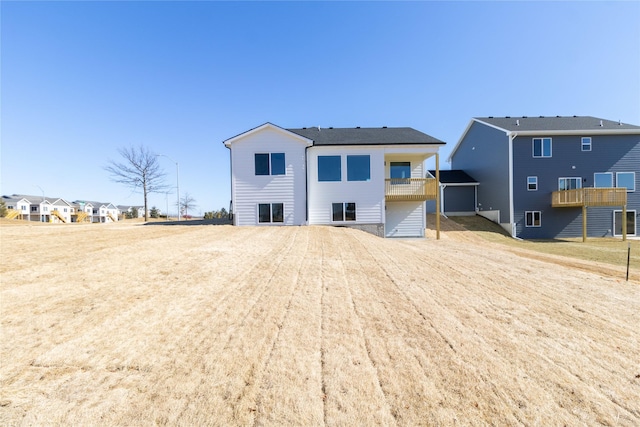 back of property featuring a balcony