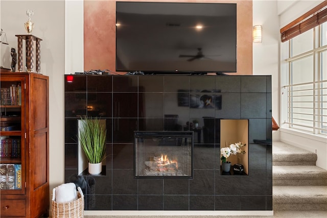 interior space featuring a tiled fireplace