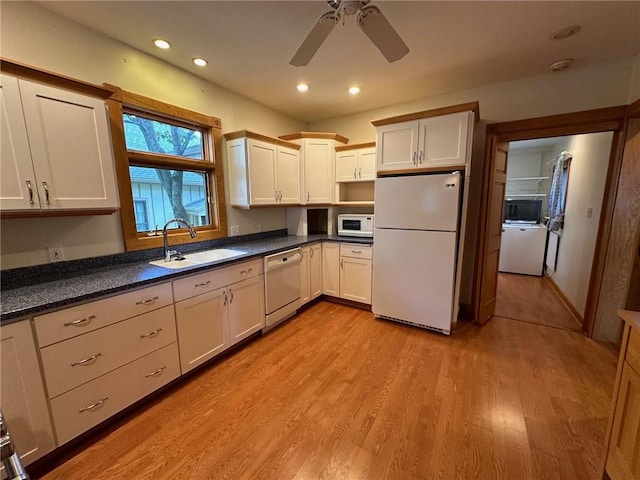 kitchen featuring ceiling fan, sink, white appliances, and light hardwood / wood-style floors