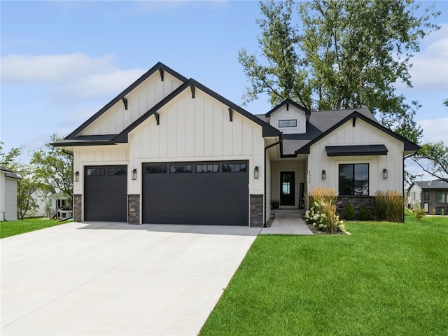 modern inspired farmhouse featuring a front yard and a garage