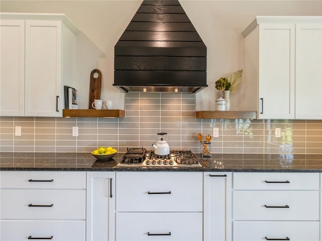 kitchen with premium range hood, stainless steel gas cooktop, and white cabinets