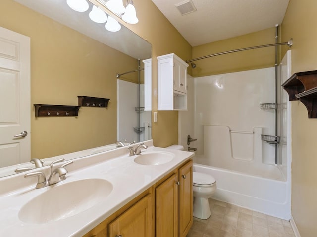 full bathroom with washtub / shower combination, toilet, a sink, and visible vents