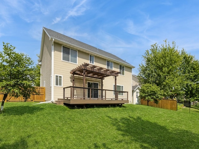 back of property featuring a fenced backyard, a lawn, a deck, and a pergola