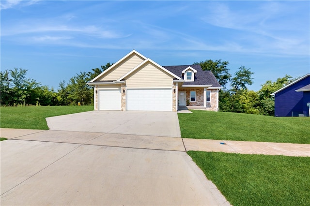 view of front of property with a garage and a front yard