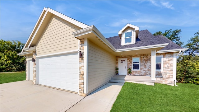 view of front of property with a garage and a front yard