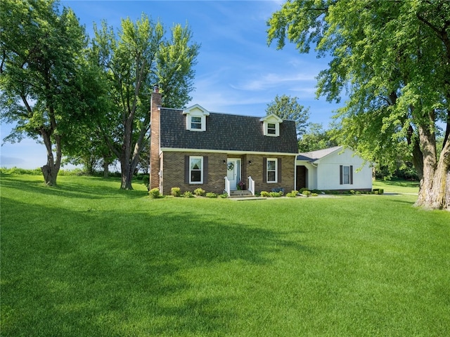 new england style home with a front lawn