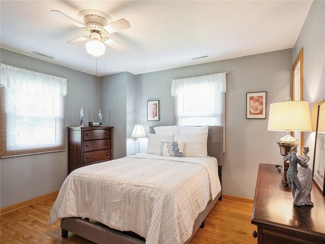 bedroom featuring ceiling fan and light hardwood / wood-style flooring