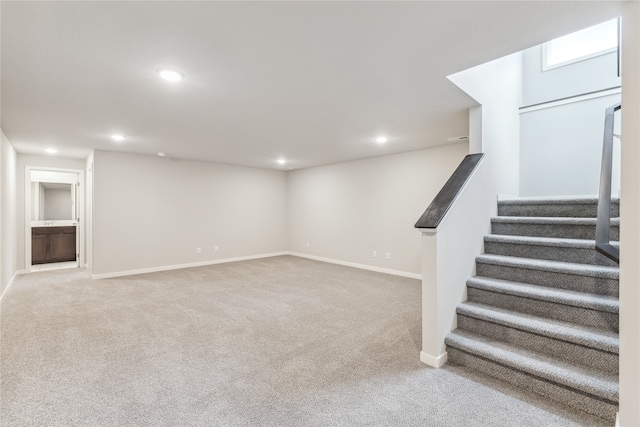 basement with light colored carpet