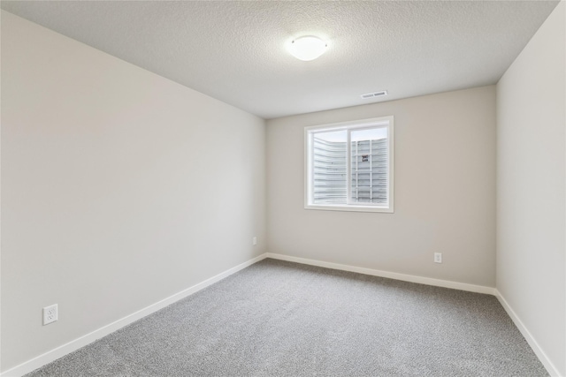 2925 3rd Ave SW, Altoona, IA 50009 - empty room featuring carpet floors, a textured ceiling, and baseboards