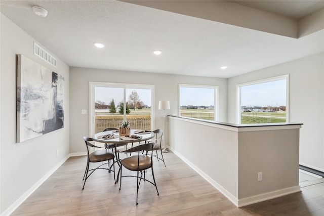 dining room featuring light hardwood / wood-style flooring