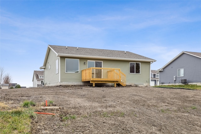 back of property with a wooden deck