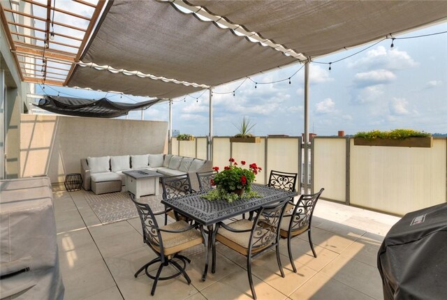 view of patio with area for grilling and an outdoor living space