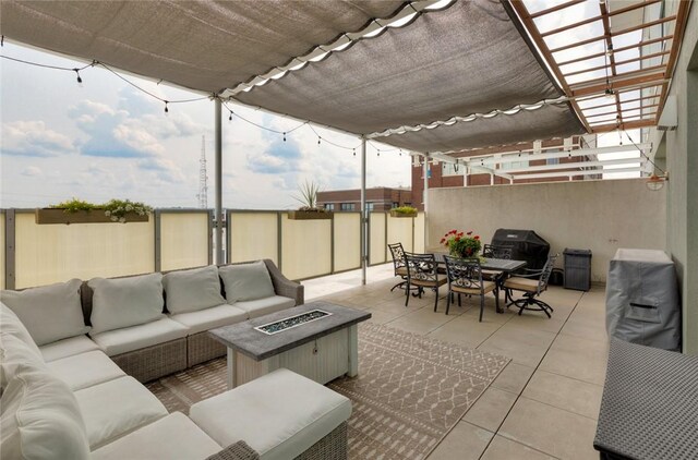 view of patio / terrace featuring an outdoor living space with a fire pit