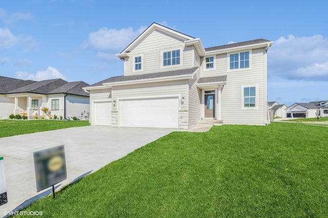 view of front of home featuring a front lawn and a garage