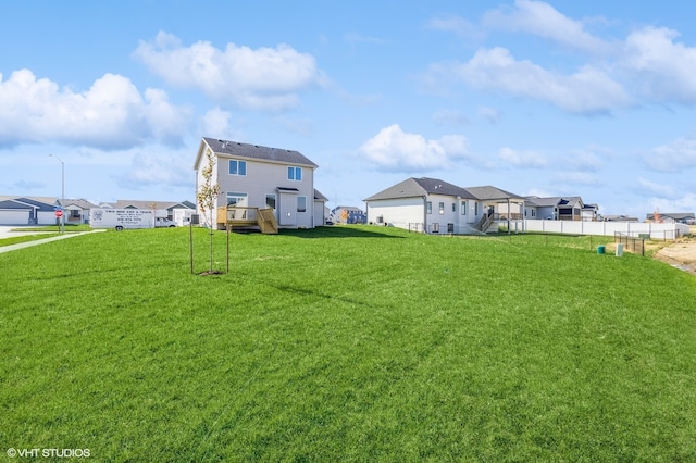 view of yard featuring a residential view and fence