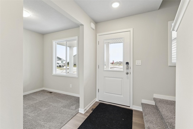 303 29th St SW, Altoona, IA 50009 - entrance foyer featuring light wood-type flooring and stairs