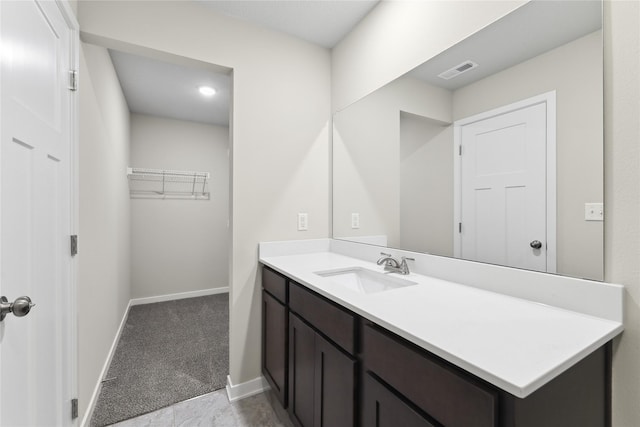 303 29th St SW, Altoona, IA 50009 - bathroom with vanity and baseboards