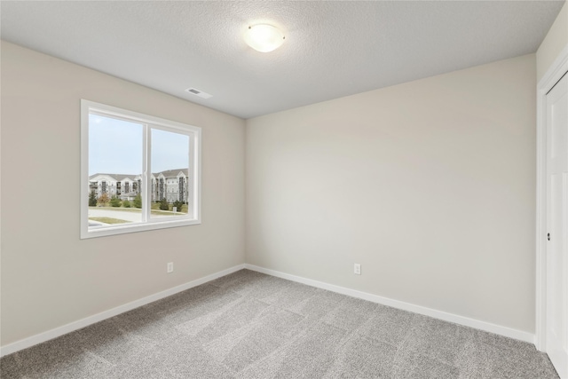 303 29th St SW, Altoona, IA 50009 - empty room with light colored carpet and a textured ceiling