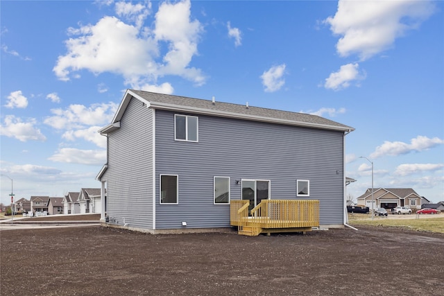 303 29th St SW, Altoona, IA 50009 - rear view of property featuring a wooden deck and a residential view