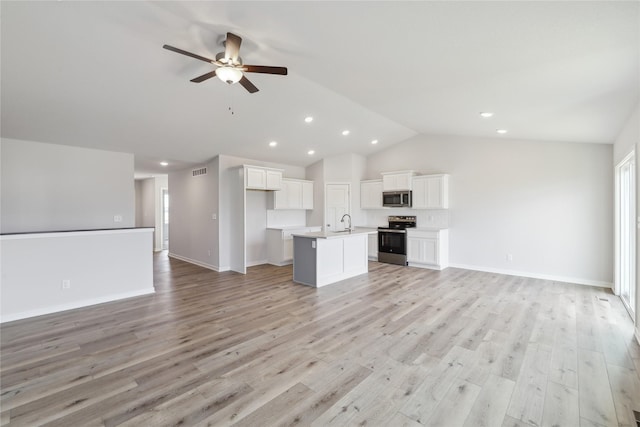 unfurnished living room with light hardwood / wood-style floors, ceiling fan, lofted ceiling, and sink